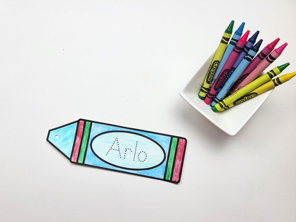 The crayon bookmark with a hole punched out of the top. 