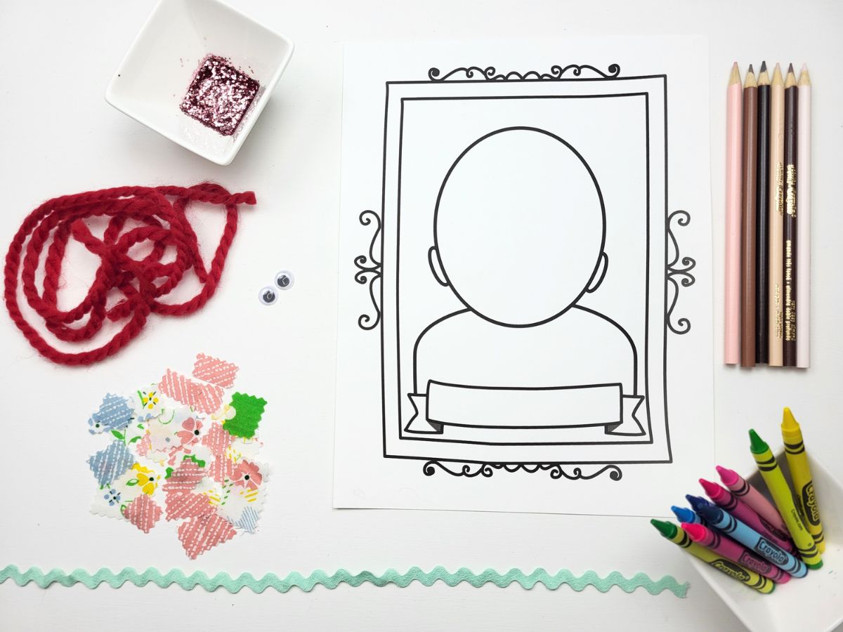Kids Portrait Collage Craft page surrounded by crafting materials - red yarn glitter, fabric scraps, pencils and crayons. 