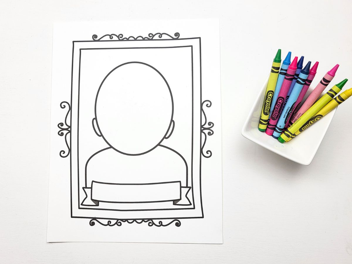 Portrait Page beside a container of colourful crayons. 